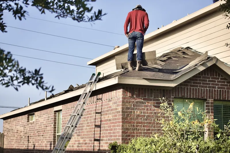 Professional roofer working on a residential roof in La Cresta